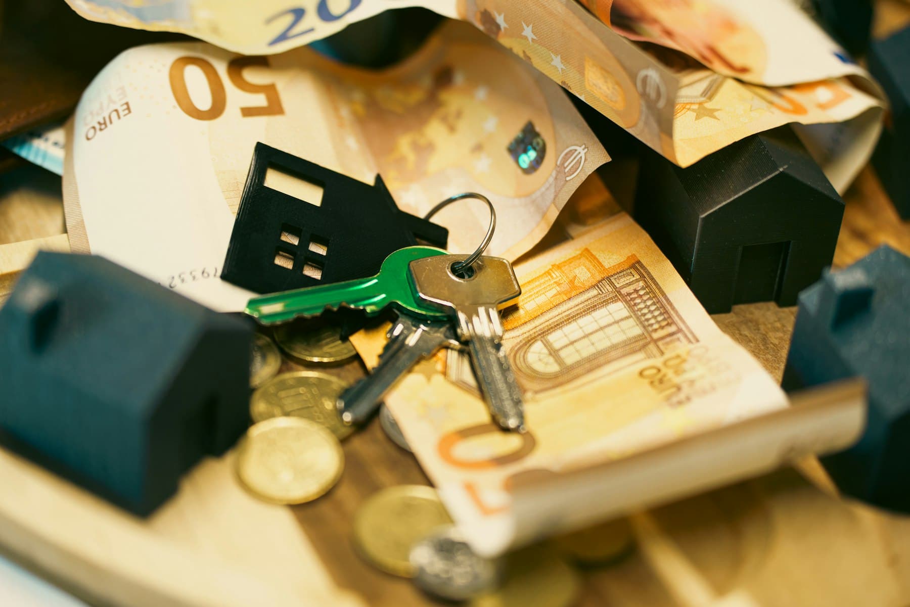 House keys and money representing guaranteed rental income